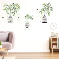 Decorative wall sticker of a multi colored birdcage in a garden setting RPCFS6037T50