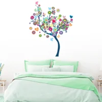 Wall sticker featuring a colorful tree with round leaves and butterflies RPCFS6033T50