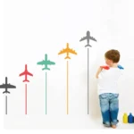 Wall sticker of brightly colored airplanes soaring through the sky RPC942